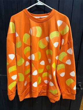 Bright Orange Crewneck Sweater with Lime and White Graphic Accents